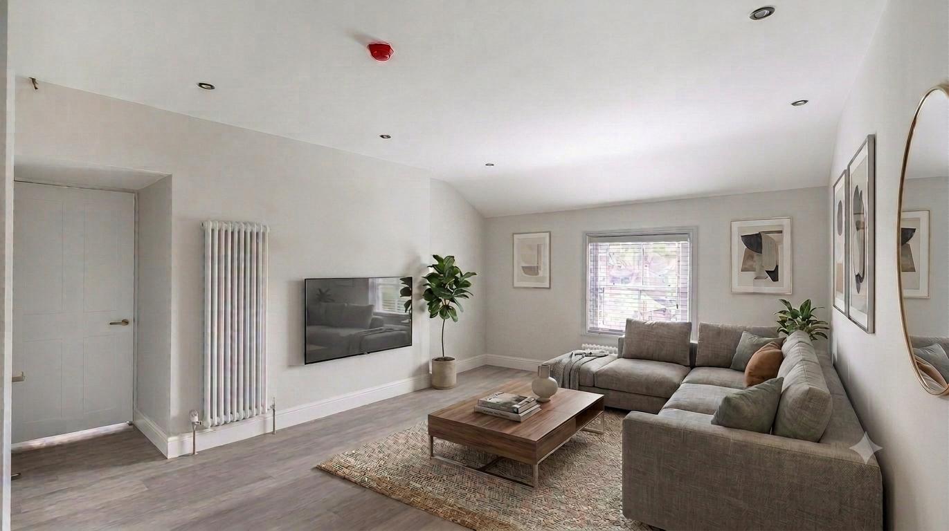 Modern furnished living room with corner sofa and TV